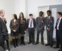 Mr johnson mp mr guthrie ceo edeavour mat chatting with students lilah 2nd student from left enoch 2nd student from right